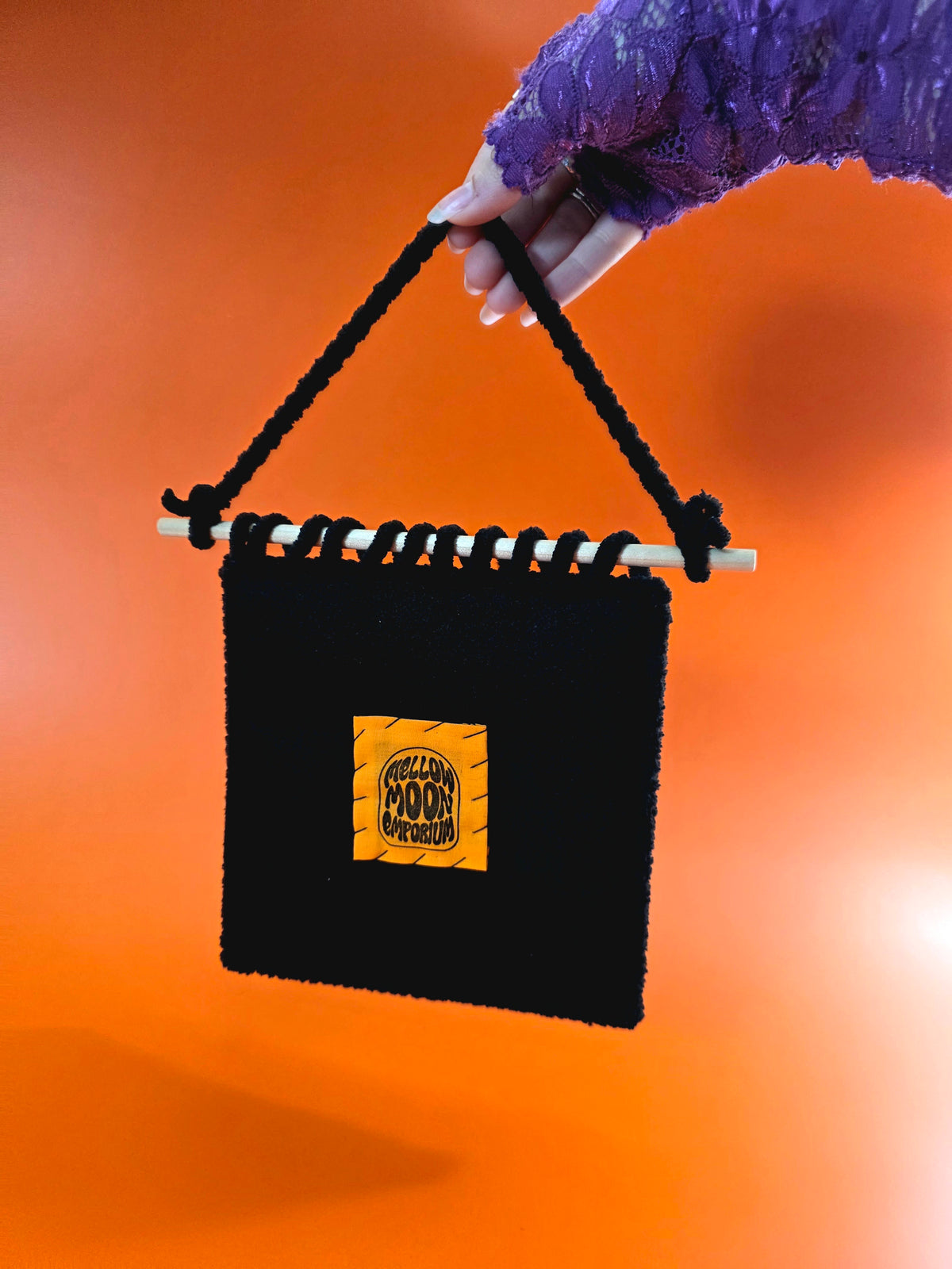 the back of the wall hanging has a mellow moon emporium orange label hand sewn onto black premium felt.