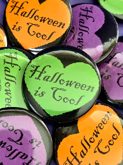 a green button that says "Halloween is cool" with a black heart around it