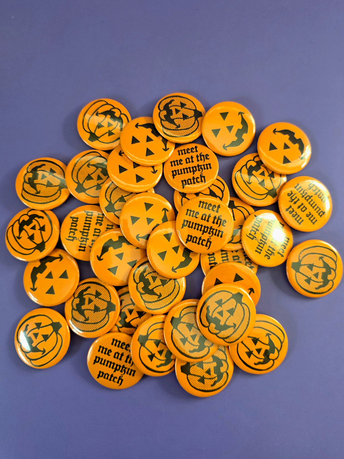 a pile of all the pumpkin buttons