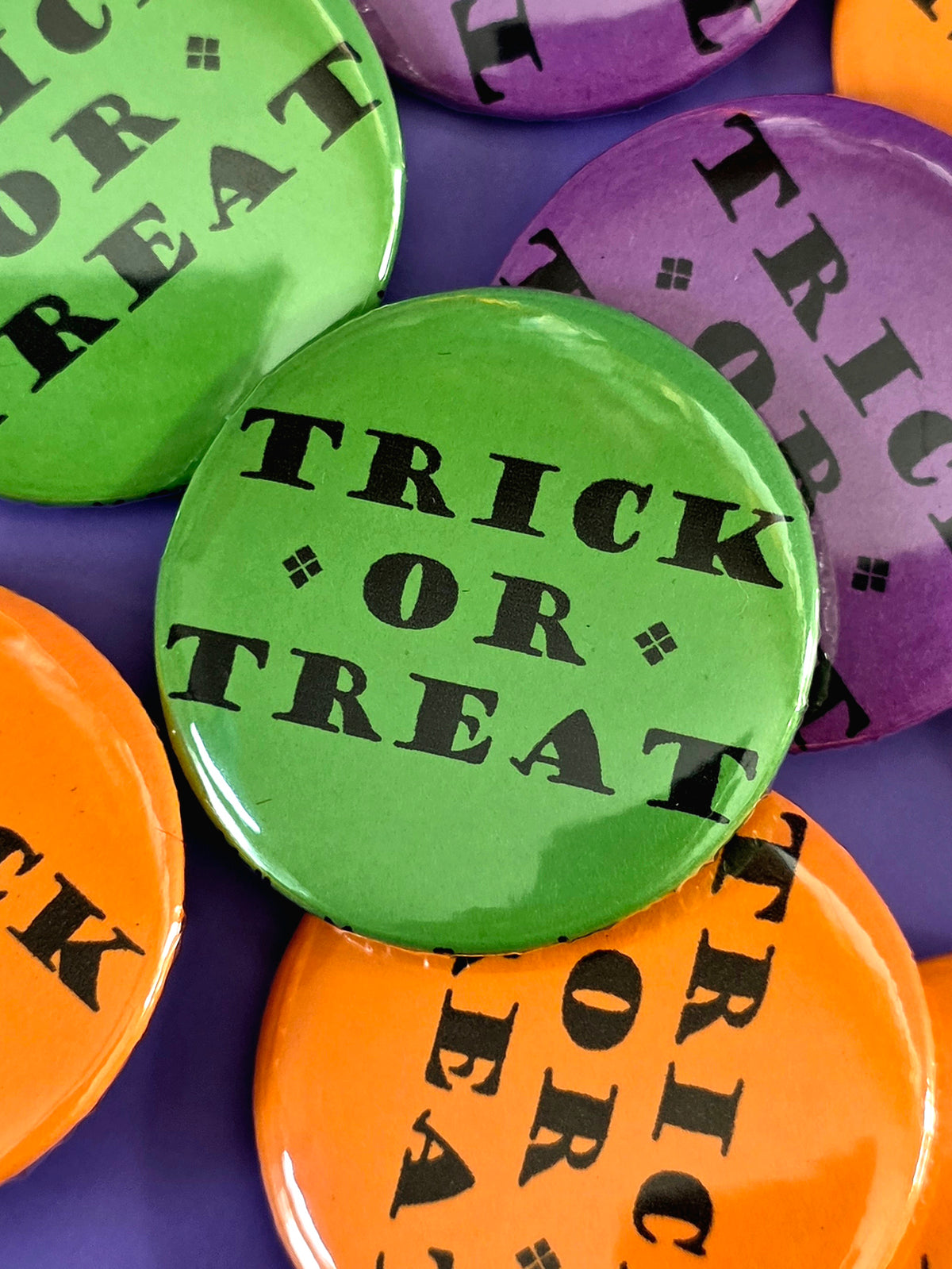 a green button that that says "trick or treat"